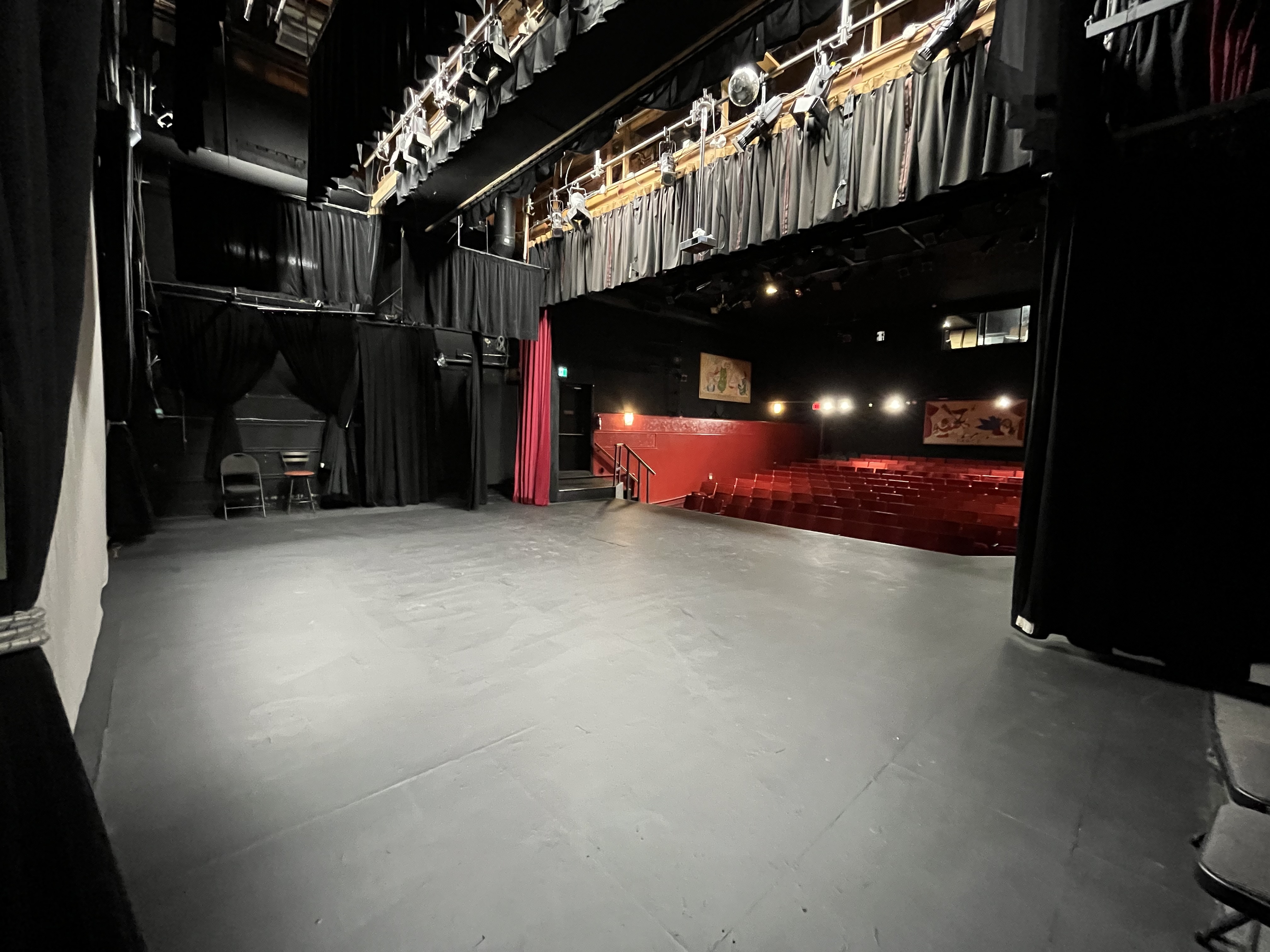 The auditorium of the Village Theatre, showing the stage and seating area.